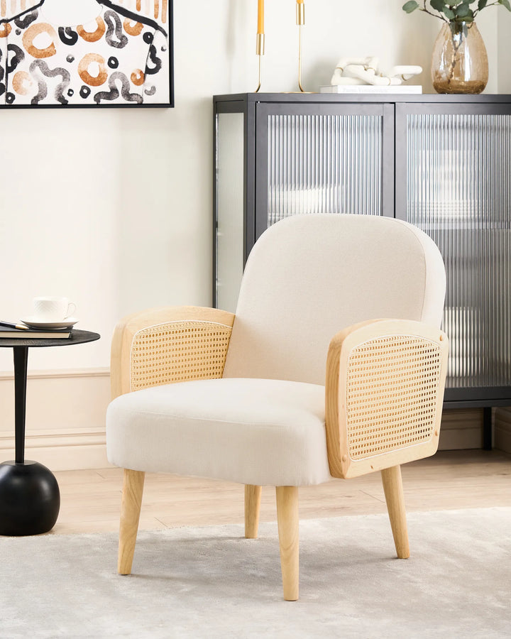 Beige armchair with wicker backrest in a modern living room setting