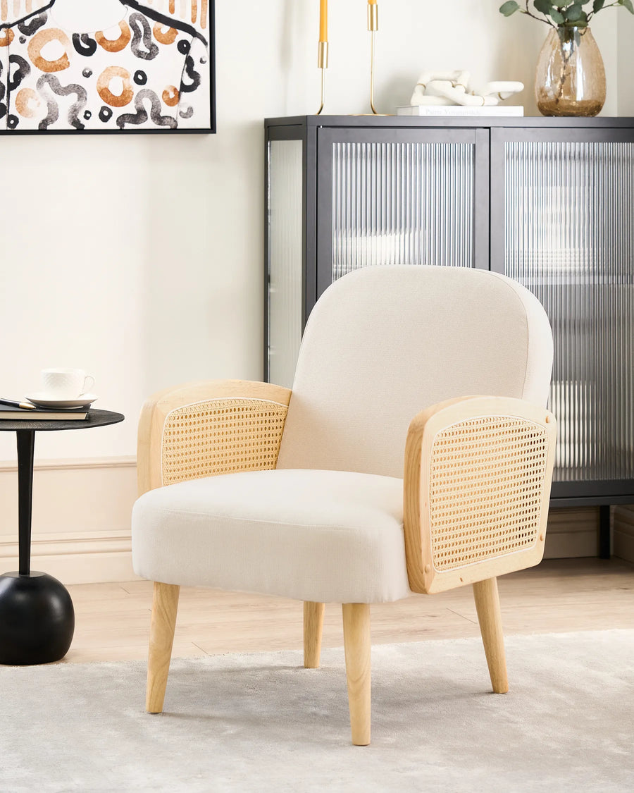 Beige armchair with wicker backrest in a modern living room setting