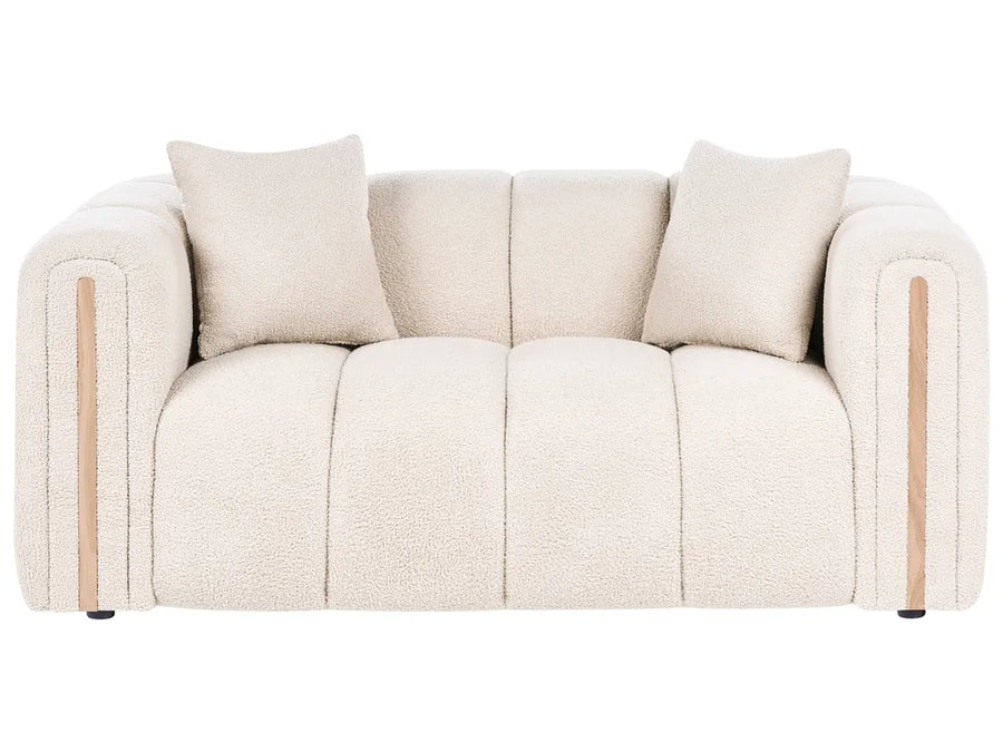 Beige sofa with wooden armrests on a white background