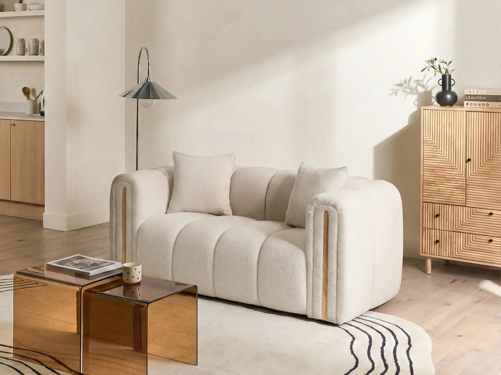 Modern living room with a beige sofa, wooden coffee table, and sideboard.