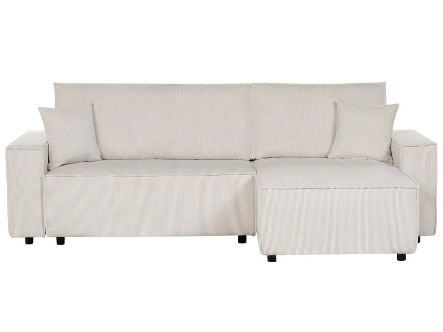 Beige sectional sofa with chaise on a white background