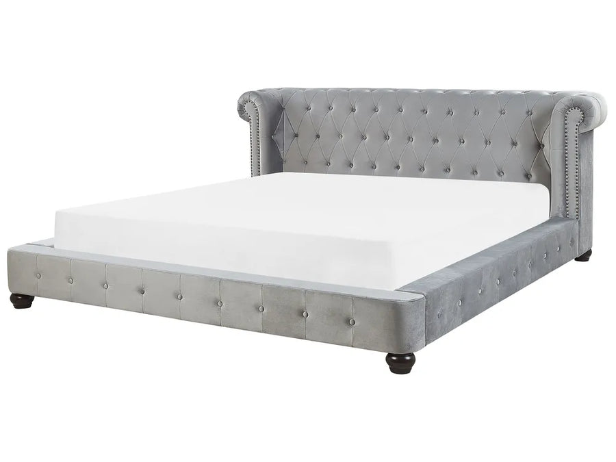 Light grey velvet waterbed with tufted headboard