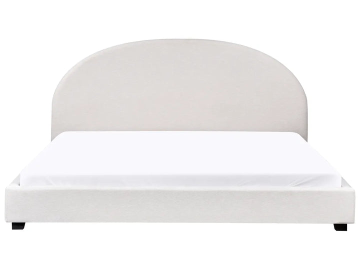 White bed with a rounded headboard on a white background