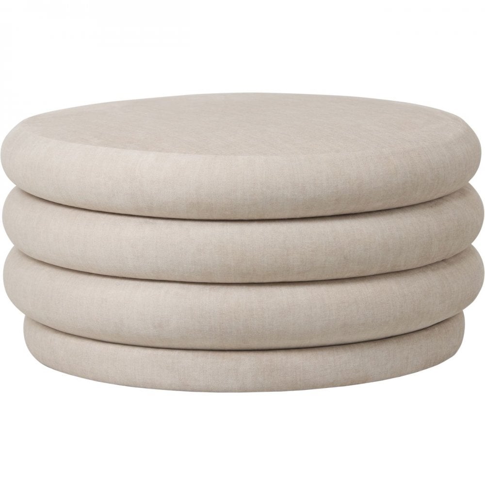 Beige ottoman with stacked cylindrical shapes on a white background