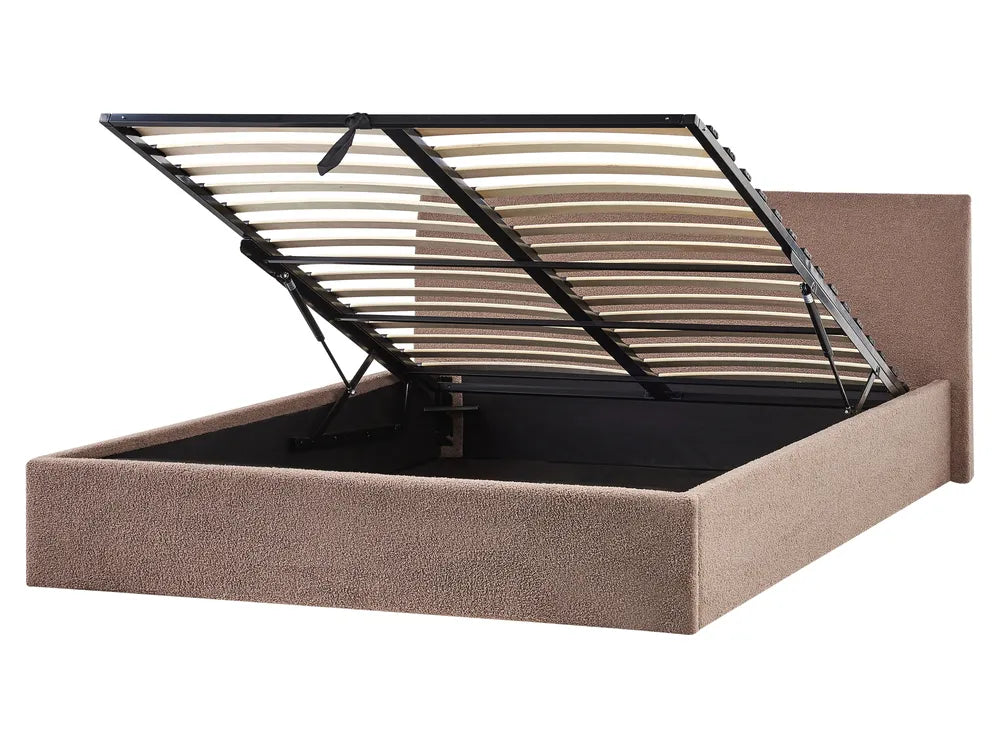 Beige upholstered bed frame with metal slat support on a white background