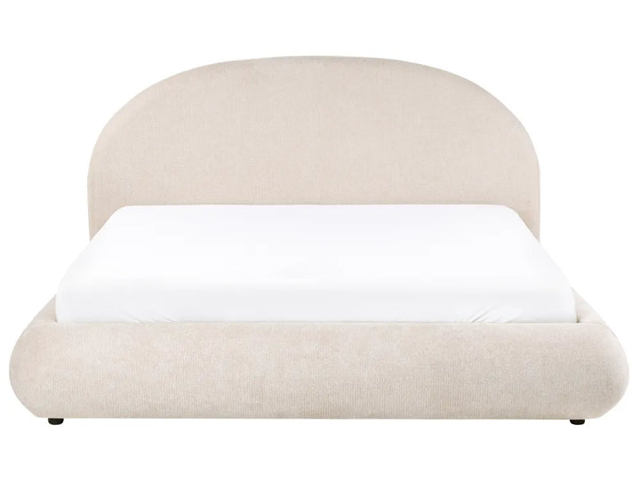 Beige upholstered bed with white mattress on a white background