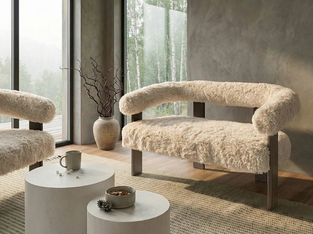 Modern interior with fluffy armchair and side tables near large windows.