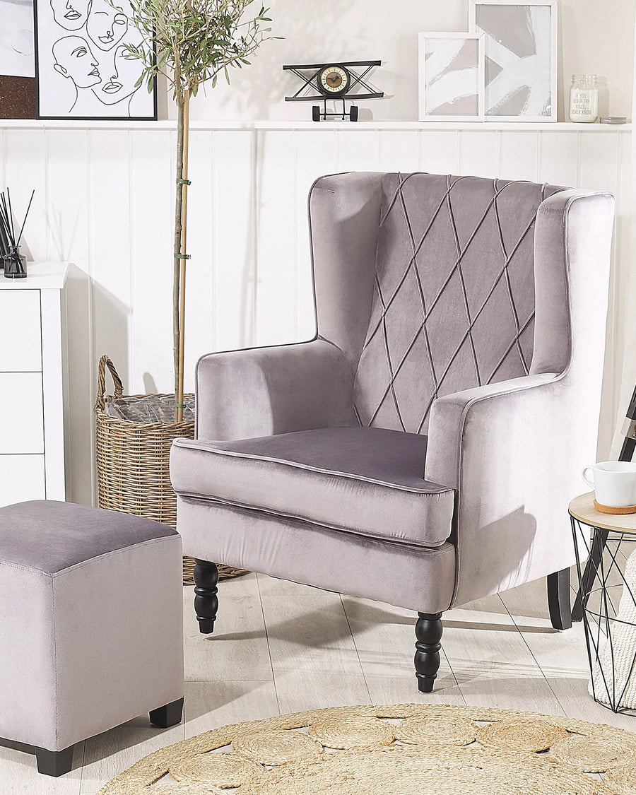 Gray armchair with diamond pattern in a living room setting
