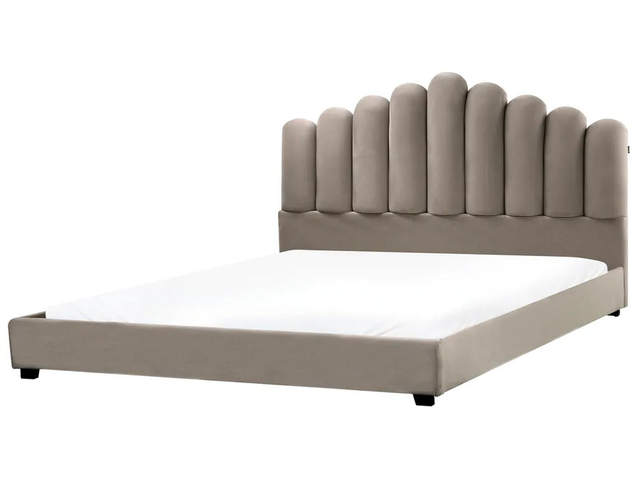 Beige upholstered bed with white mattress on a white background