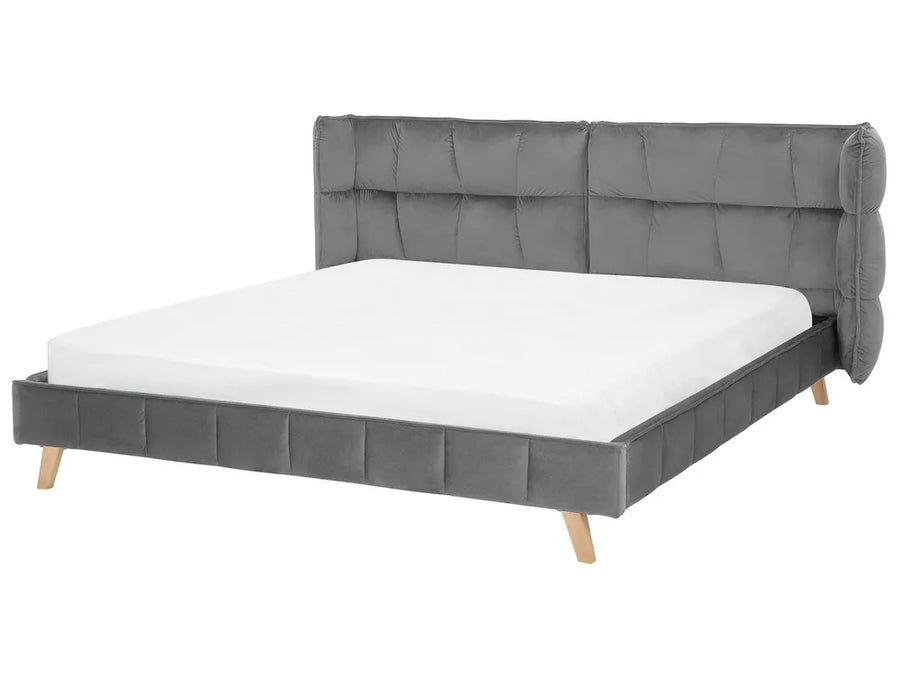 Gray upholstered bed with white mattress on a white background