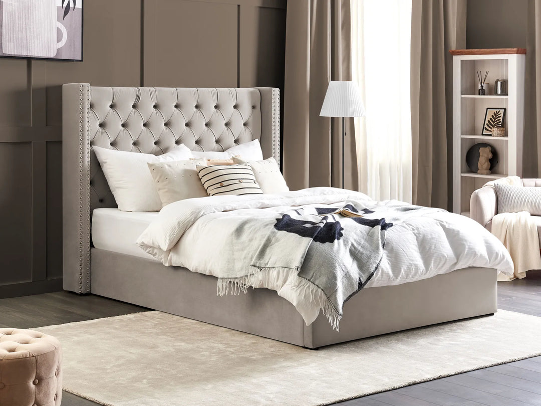 Neatly made bed with decorative pillows in a bedroom setting.