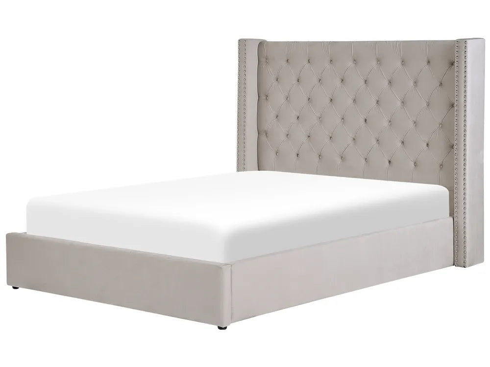 Gray upholstered bed with tufted headboard on a white background