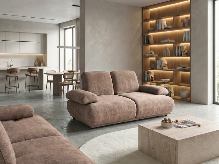 Modern living room with brown sofa, coffee table, and bookshelf.