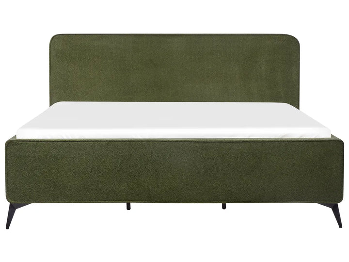 Green upholstered bed with white mattress on a white background