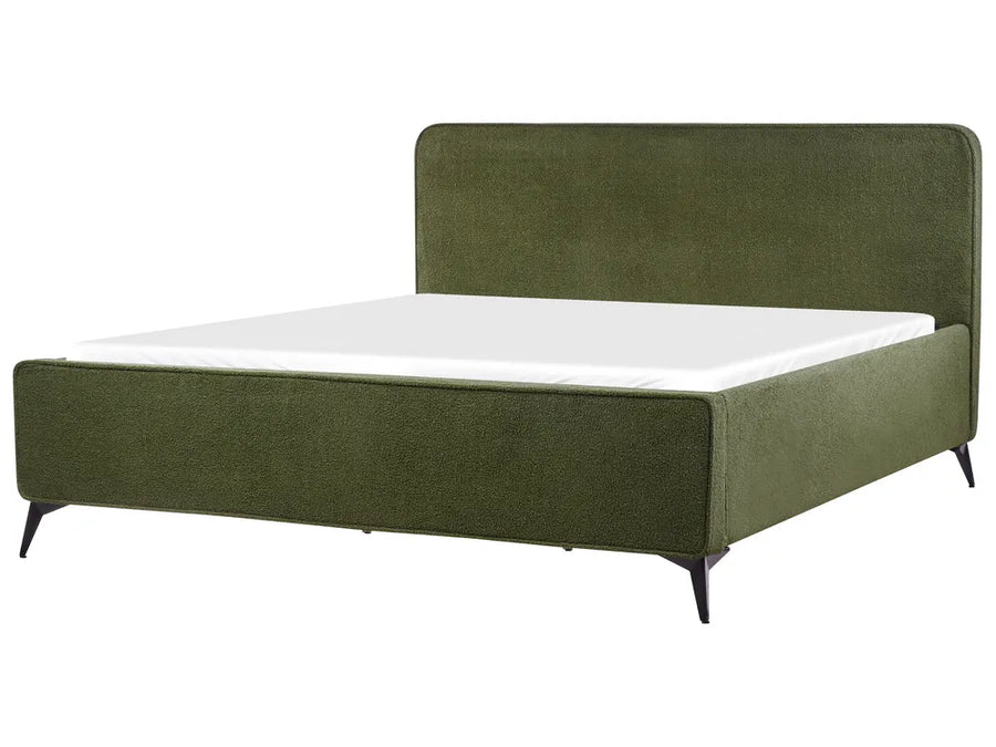 Green upholstered bed with white mattress on a white background