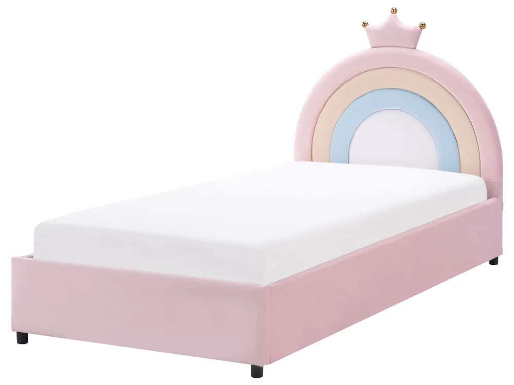 Pink children's bed with rainbow design and crown on a white background