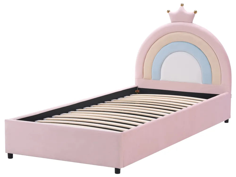Pink children's bed with rainbow design and crown on a white background