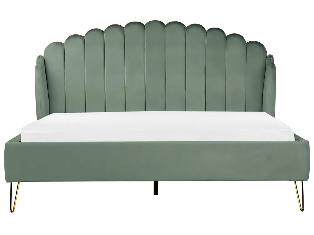 Green upholstered bed with scalloped headboard 