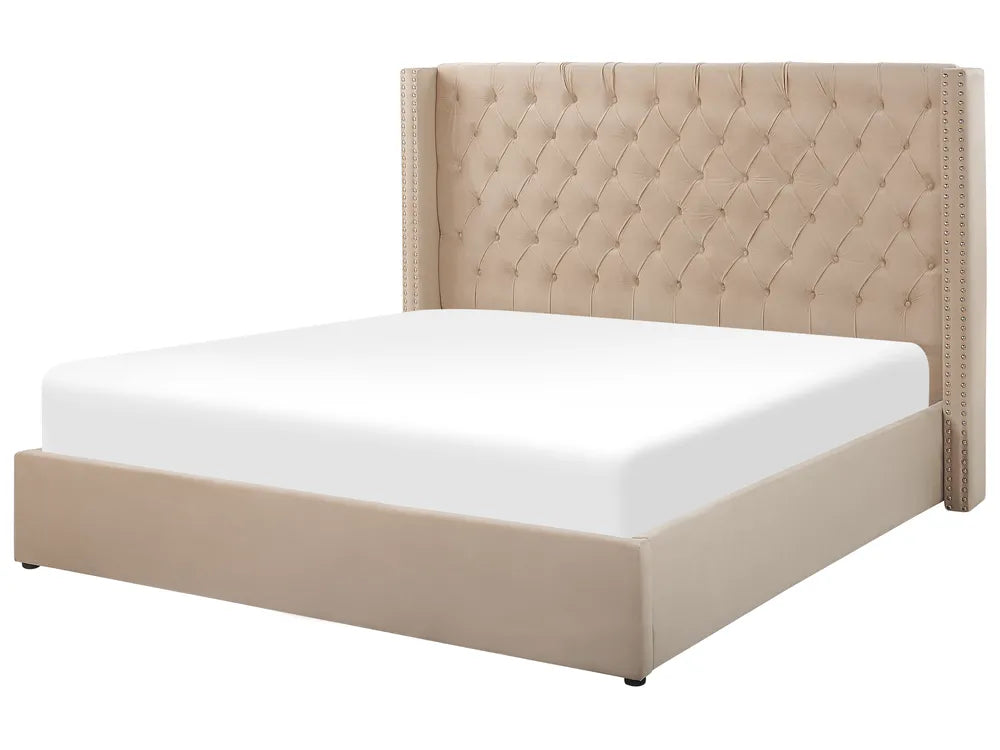 Beige upholstered bed with white mattress on a white background