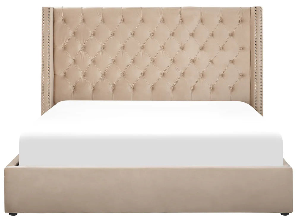 Beige upholstered bed with tufted headboard on a white background