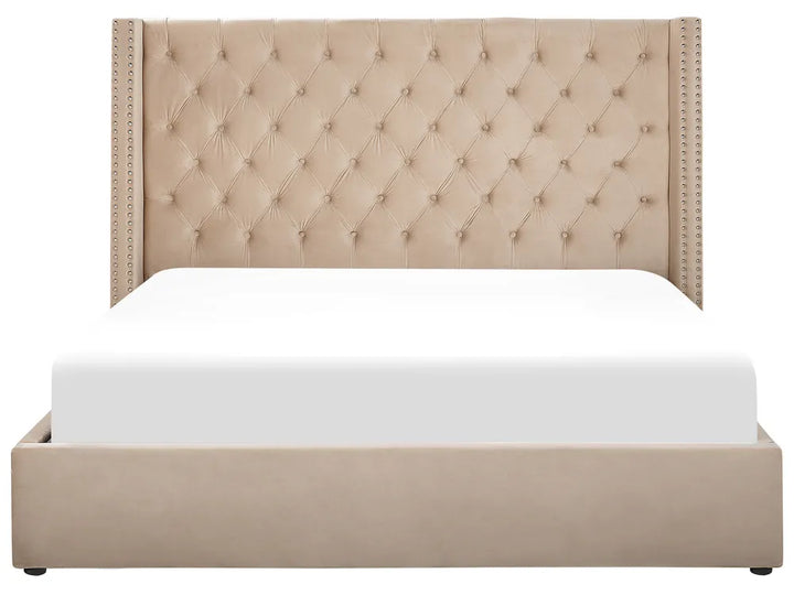 Beige upholstered bed with tufted headboard on a white background