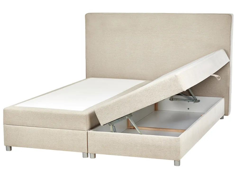 Beige upholstered bed with storage compartment on a white background