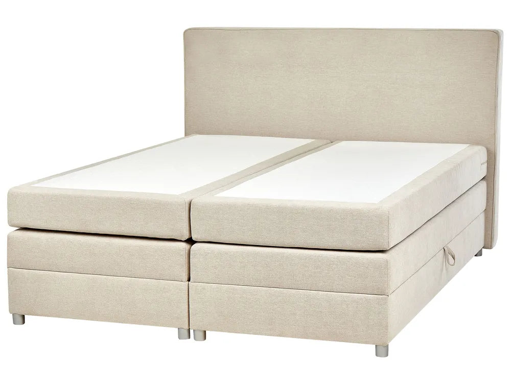 Beige boxspring bed with white mattress on a white background