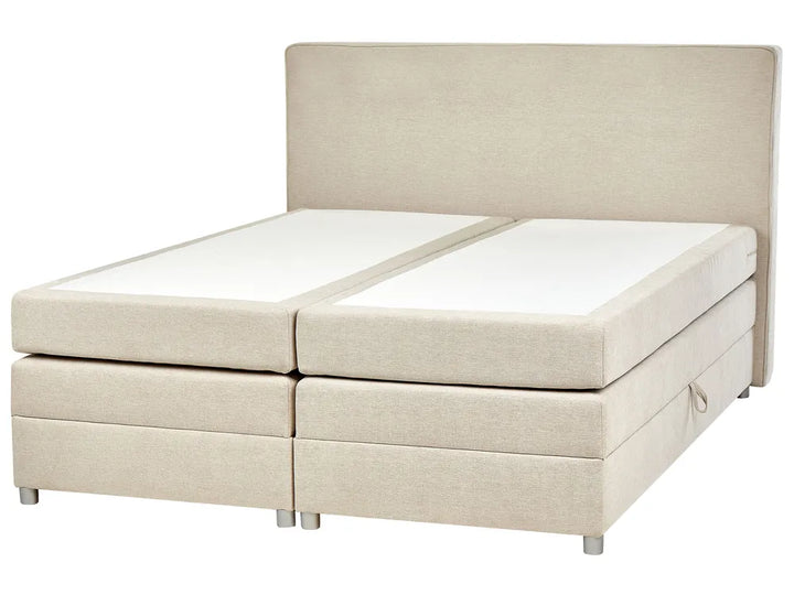 Beige boxspring bed with white mattress on a white background
