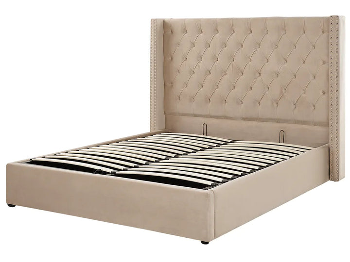 Beige upholstered bed frame with tufted headboard on a white background