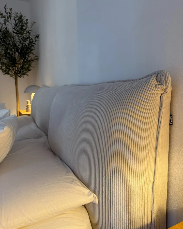 Contemporary super king bed with padded headboard