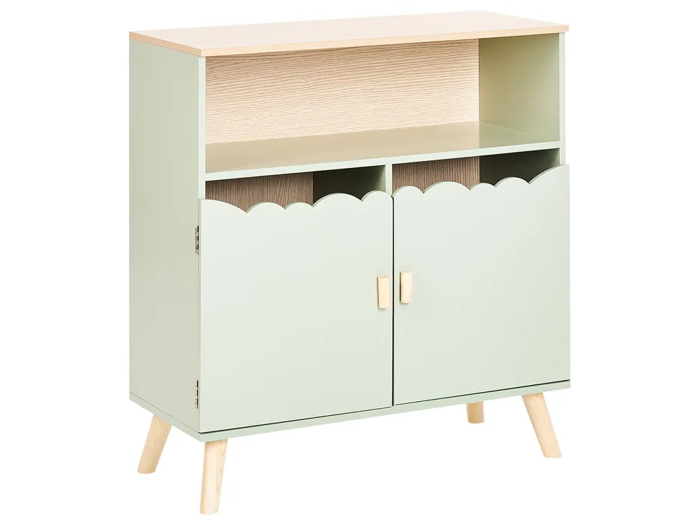 Light green cabinet with scalloped white doors on a white background