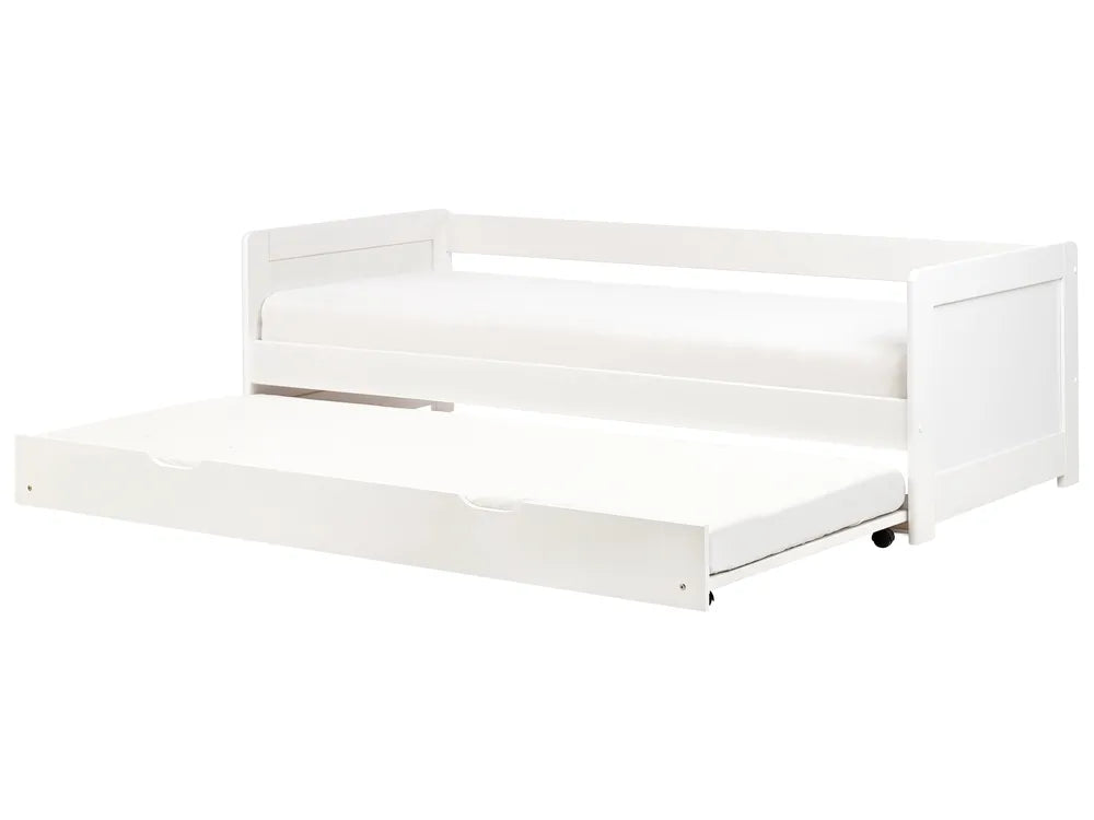 White crib with clear plastic sides on a white background