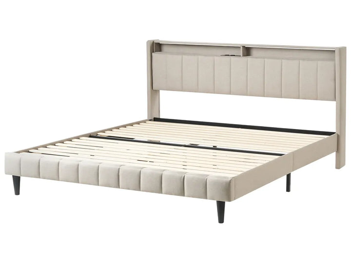 Beige upholstered bed frame on a white background