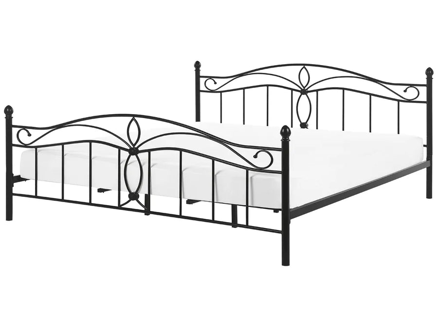 Wrought iron bed frame on a white background