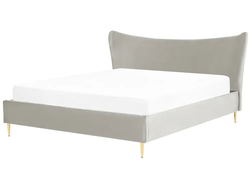 Gray upholstered bed with white mattress on a white background