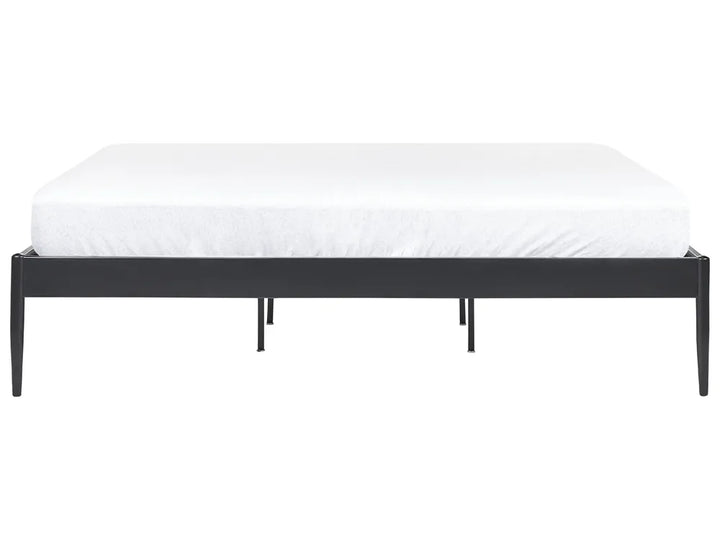 Black metal bed frame with white mattress on a white background