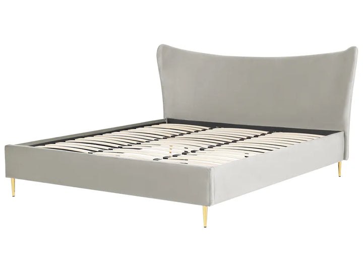 Gray upholstered bed with wooden legs on a white background