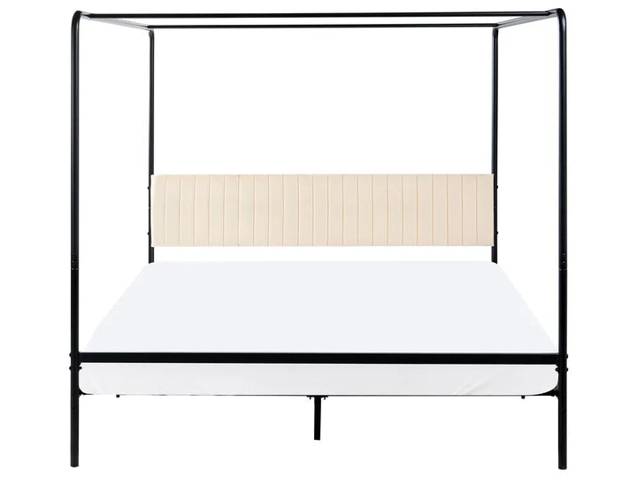 Black metal canopy bed with white mattress on a white background