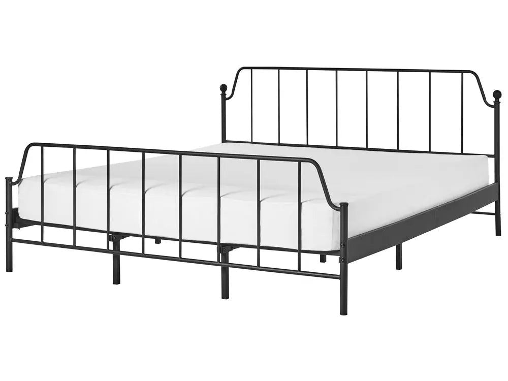 Black metal bed frame with white mattress on a white background