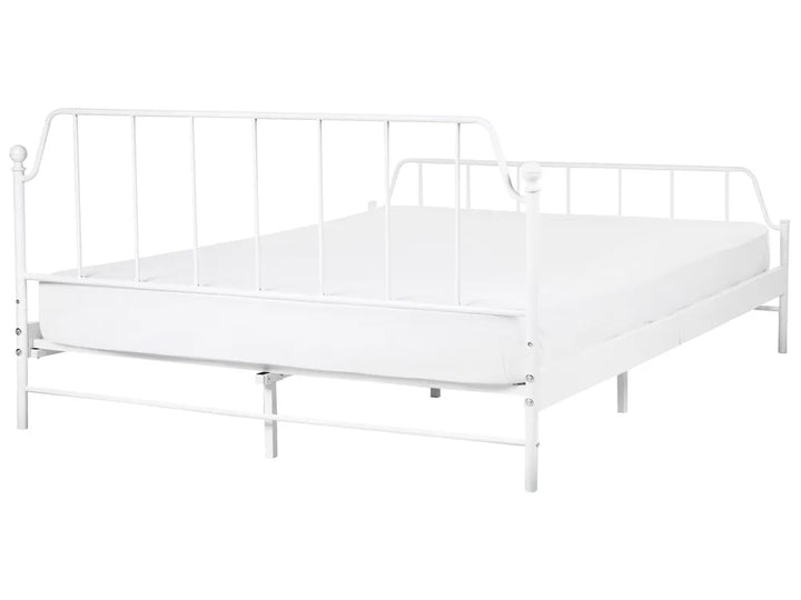 White metal bed frame with mattress on a white background