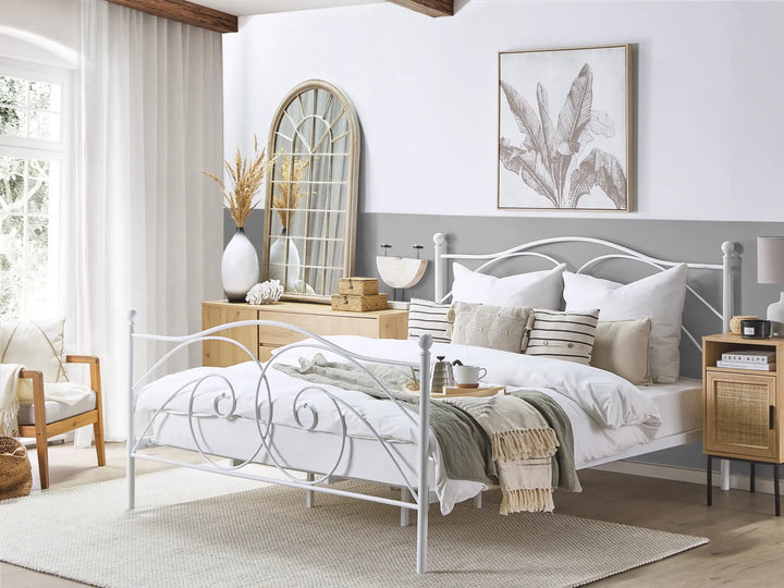 Neatly made bed in a bedroom with decorative pillows and a side table.