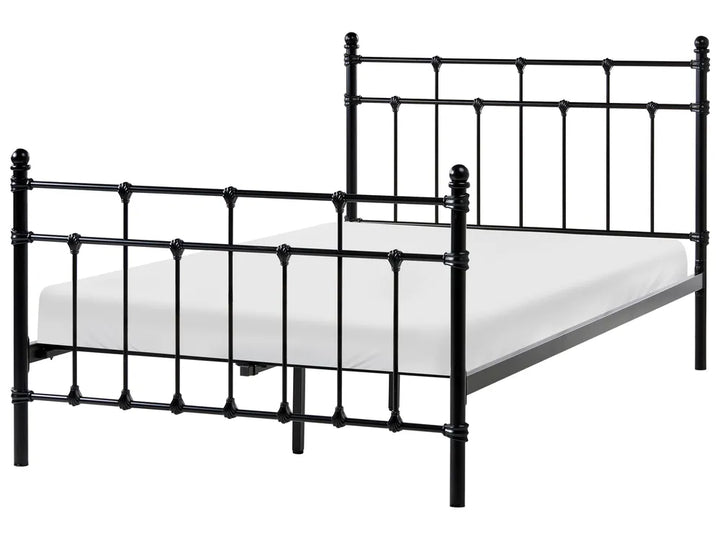 Black metal bed frame with mattress on a white background