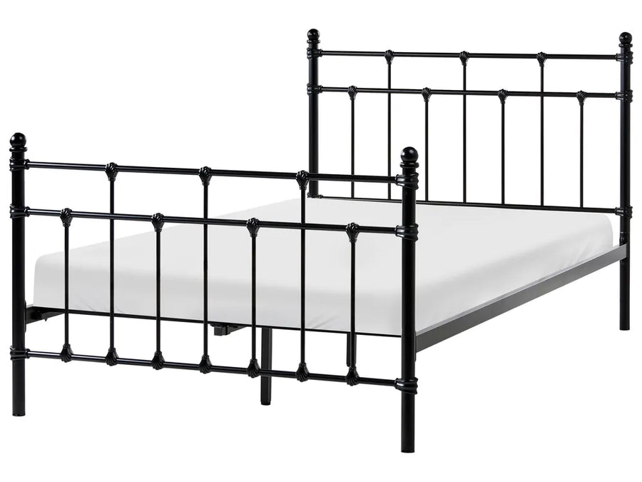 Black metal bed frame with mattress on a white background