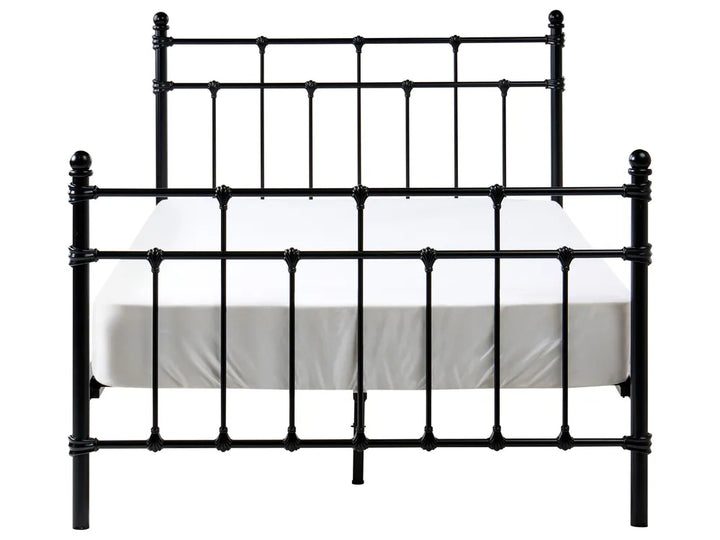Black metal bed frame with white mattress on a white background