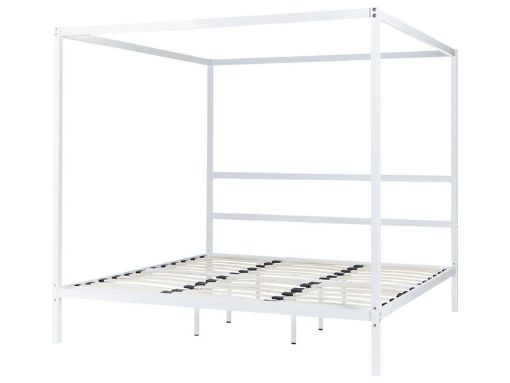 White metal canopy bed frame on a white background