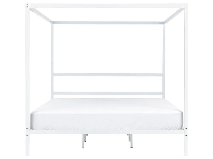 White metal canopy bed frame on a white background