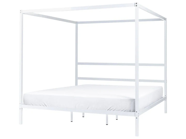 White metal canopy bed frame on a white background