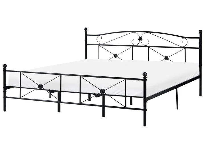Black metal bed frame on a white background