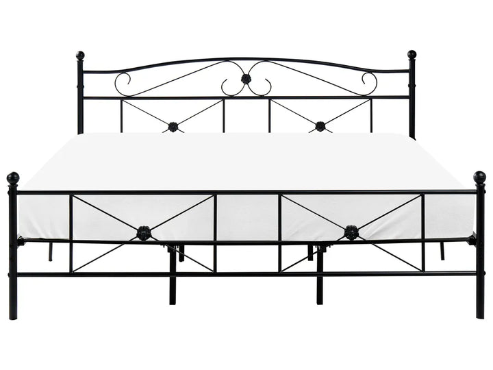 Black metal bed frame with decorative headboard on a white background