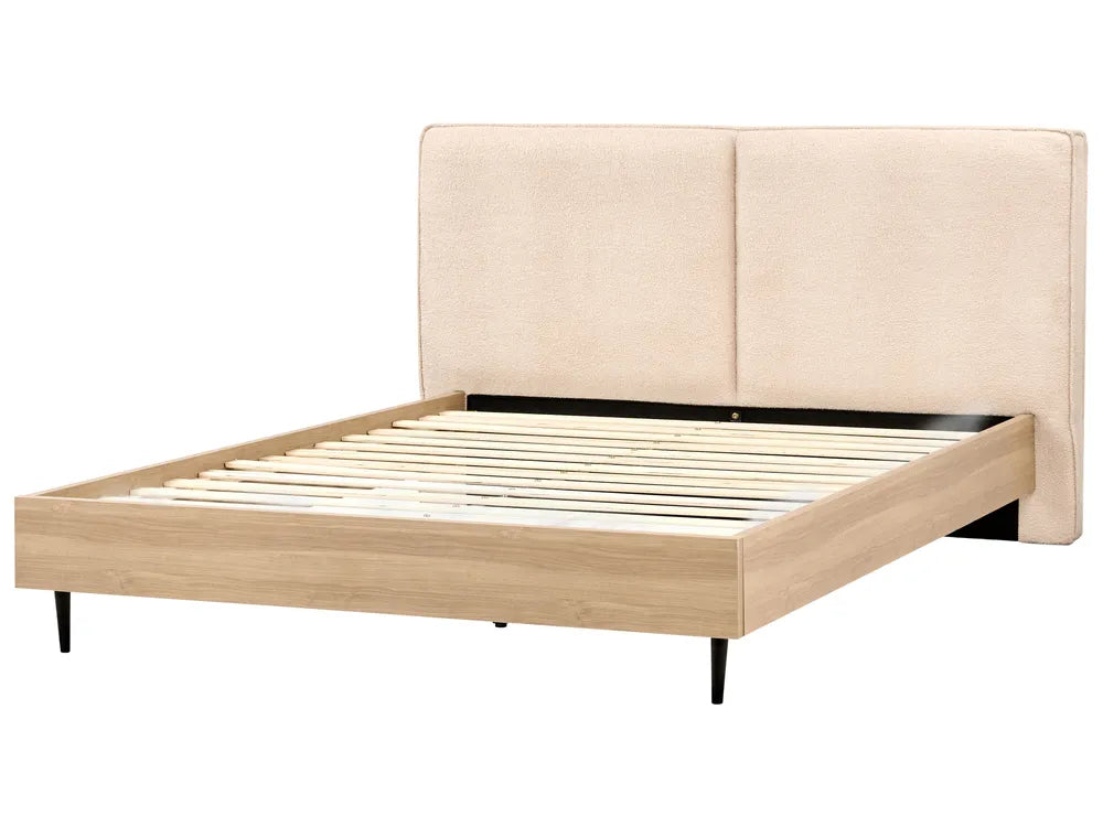 Beige upholstered bed frame with wooden slats on a white background